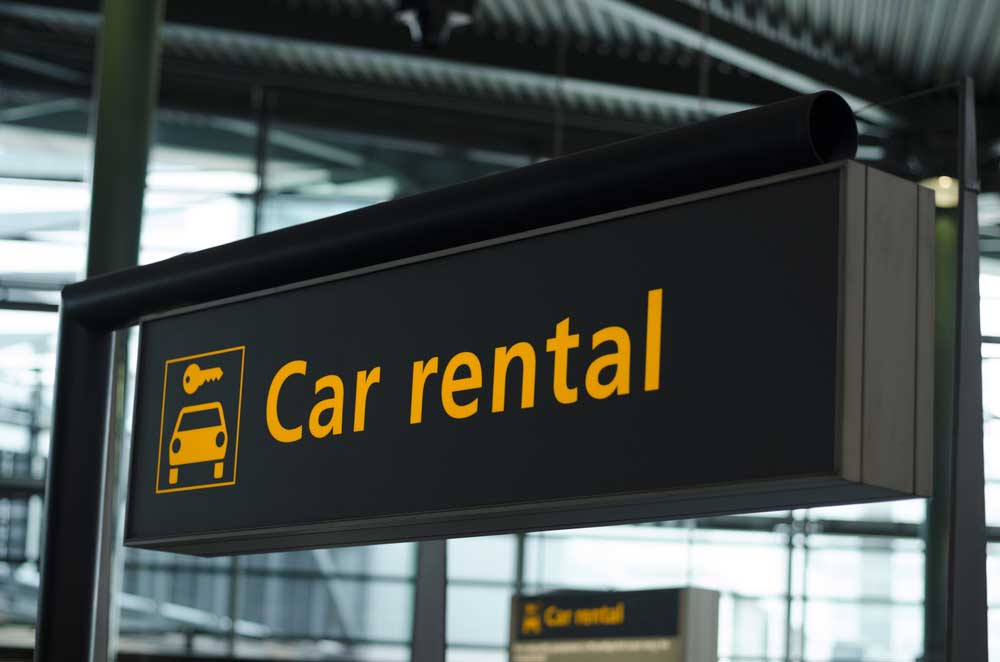 Signage With Direction To Car Rental — Fast & Affordable Car Hires in Bilinga, QLD