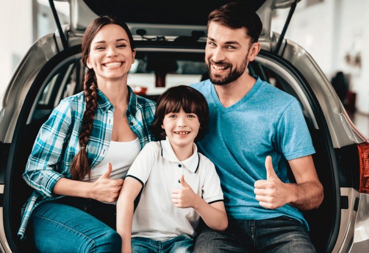 Family of 3 Is Sitting in The Back of Rental Car — Fast & Affordable Car Hires in Bilinga, QLD
