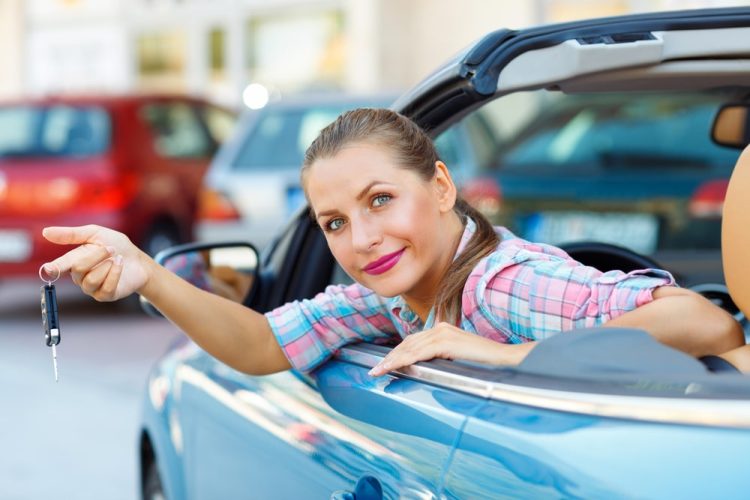 Woman Holding Car Key — Fast & Affordable Car Hires in Bilinga, QLD